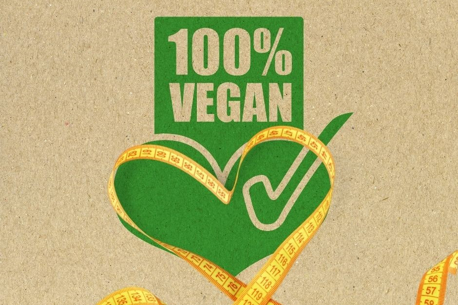 Vegan abnehmen dargestellt von vegan Logo und Maßband